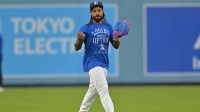 Los Angeles Dodgers center fielder Justin Dean (75) takes ground balls during World Series workouts prior to game three against the Toronto Blue Jays at Dodger Stadium.