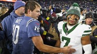 New England Patriots quarterback Drake Maye (10) and New York Jets quarterback Justin Fields (7) react after the game at Gillette Stadium.