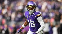 Minnesota Vikings wide receiver Justin Jefferson (18) warms up before the game against the Baltimore Ravens at U.S. Bank Stadium.