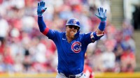 Chicago Cubs first baseman Justin Turner (3) celebrates while running the bases after hitting a homer in the third inning of the MLB National League game between the Cincinnati Reds and Chicago Cubs
