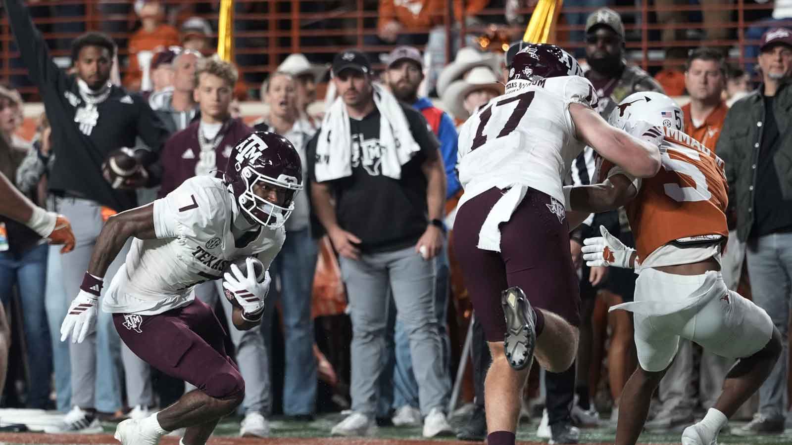 Texas A&M Aggies wide receiver KC Concepcion (7) runs for a touchdown at the end of the first half against the Texas Longhorns at Darrell K Royal-Texas Memorial Stadium.