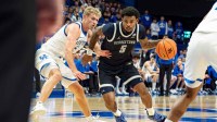 Georgetown’s KJ Lewis (5) drove to the basket for a score as the Kentucky Wildcats host the Georgetown Hoyas at Rupp Arena in Lexington on Thursday, Oct. 30, 2025.