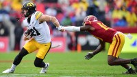 Nov 15, 2025; Los Angeles, California, USA; Iowa Hawkeyes wide receiver Kaden Wetjen (21) runs the ball against Southern California Trojans safety Bishop Fitzgerald (19) during the first half at the Los Angeles Memorial Coliseum. Mandatory Credit: Gary A. Vasquez-Imagn Images