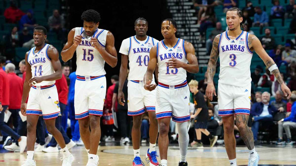 Kansas Jayhawks guard Melvin Council Jr. (14), forward Bryson Tiller (15), forward Flory Bidunga (40), guard Elmarko Jackson (13) and guard Tre White (3) walk back onto the court after a timeout against the Notre Dame Fighting Irish during the first half in a 2025 Players Era Festival group play game at MGM Grand Garden Arena.