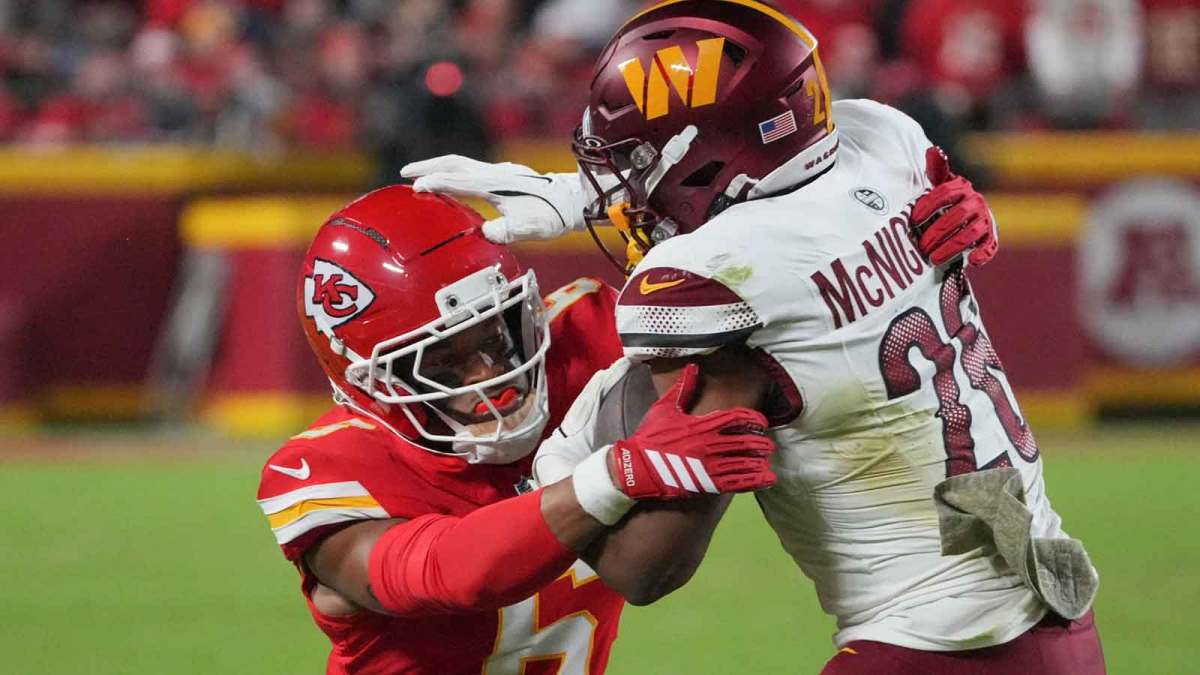 Kansas City Chiefs safety Bryan Cook (6) tackles Washington Commanders running back Jeremy McNichols (26) during the third quarter of the game at GEHA Field at Arrowhead Stadium.