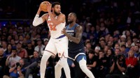 New York Knicks center Karl-Anthony Towns (32) controls the ball against Minnesota Timberwolves forward Julius Randle (30) during the second quarter at Madison Square Garden.
