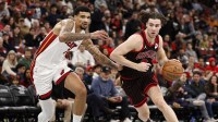 Chicago Bulls guard Josh Giddey (3) drives to the basket against Miami Heat center Kel'el Ware (7) during the first half at United Center.