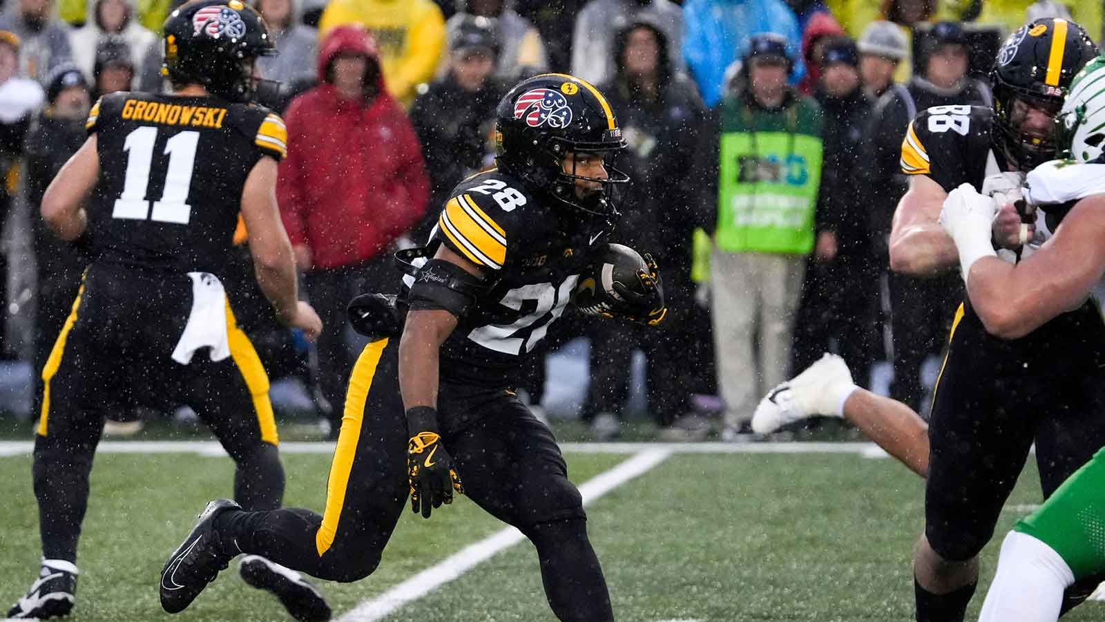 Iowa Hawkeyes running back Kamari Moulton (28) carries the ball Nov. 8, 2025 during a Big Ten Football game against the Oregon Ducks at Kinnick Stadium in Iowa City, Iowa.