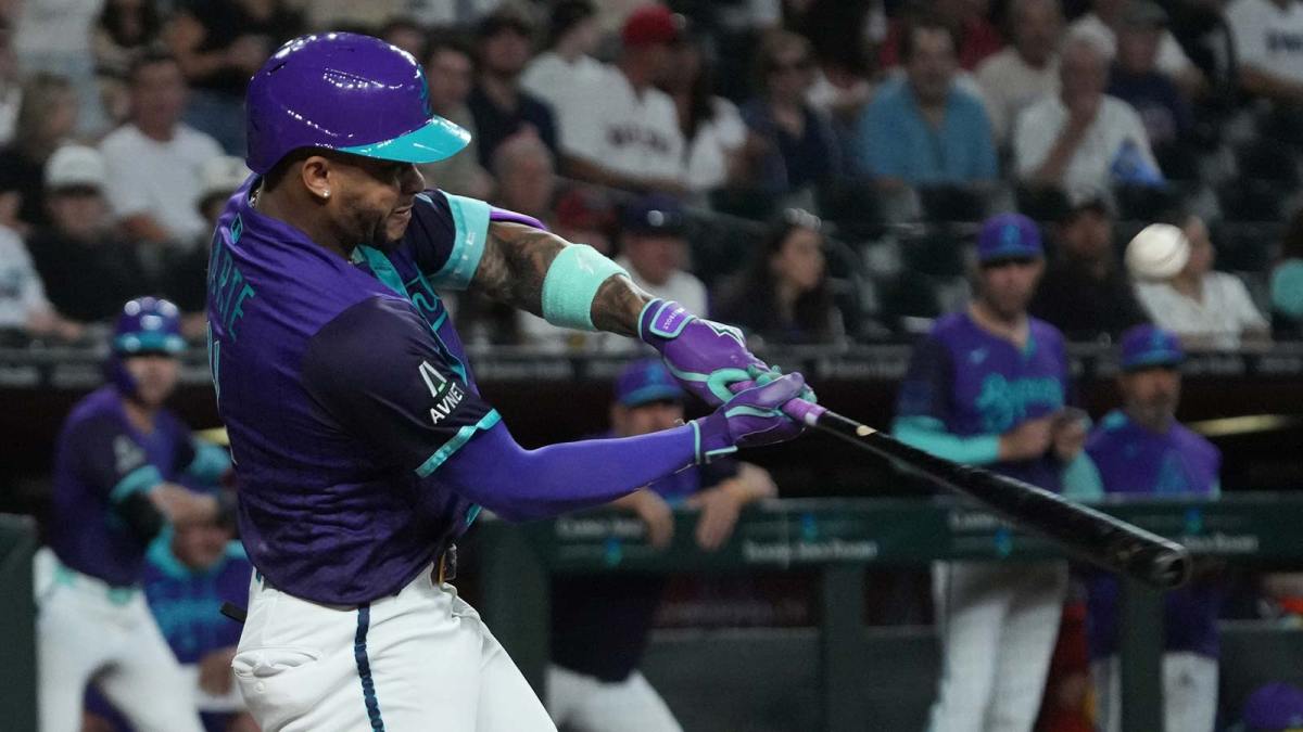 Arizona Diamondbacks second base Ketel Marte (4) hits against the Boston Red Sox in the first inning at Chase Field.