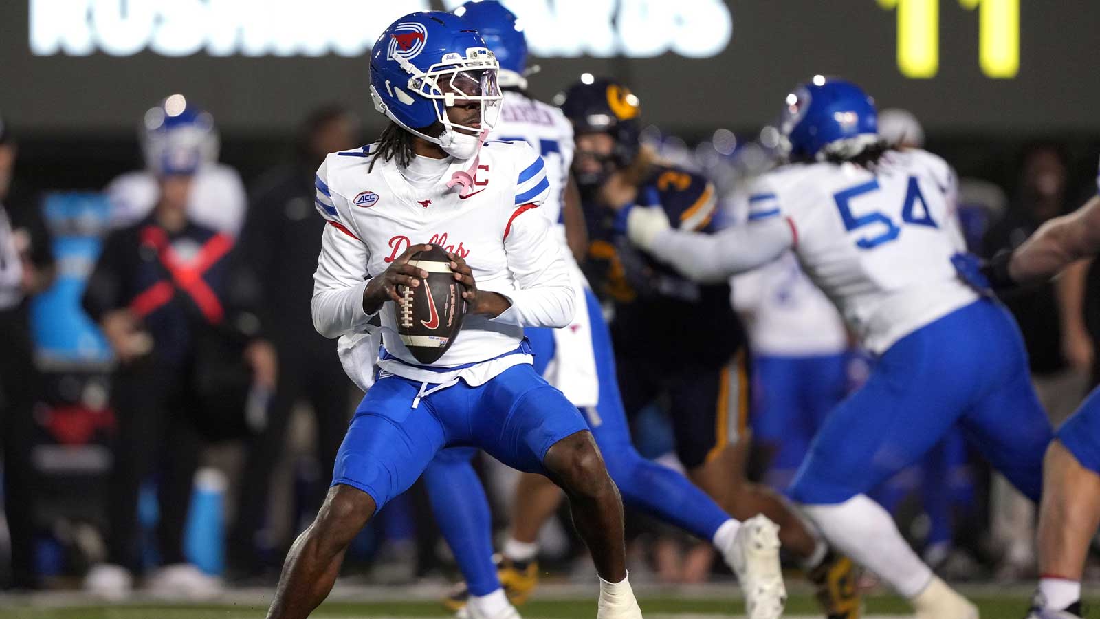 Southern Methodist Mustangs quarterback Kevin Jennings (7) drops back to pass against the California Golden Bears during the first quarter at California Memorial Stadium.