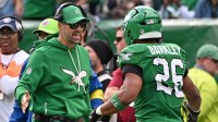 Philadelphia Eagles offensive coordinator Kevin Patullo and running back Saquon Barkley (26) against the New York Giants at Lincoln Financial Field.