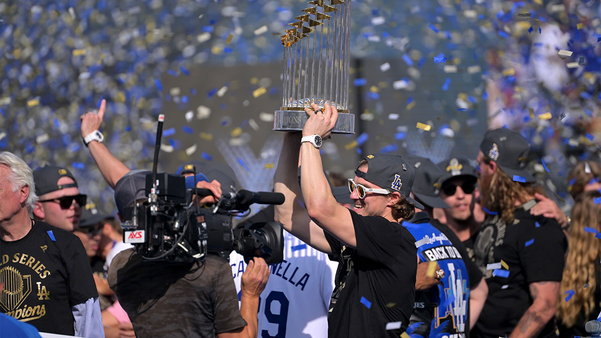Los Angeles Dodgers first baseman Enrique Hernandez (8) holds the World Series Commissioners Trophy during the World Series celebration at Dodger Stadium.