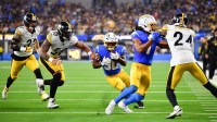 Los Angeles Chargers running back Kimani Vidal (30) carries the ball against the Pittsburgh Steelers during the fourth quarter of the game at SoFi Stadium.