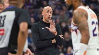 Sacramento Kings Head Coach Doug Christie motions to official Sean Corbin (33) during a time out in the second quarter of the game against the Phoenix Suns at Golden 1 Center.