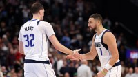 Dallas Mavericks forward Cooper Flagg (32) is greeted by guard Klay Thompson (31) during the fourth quarter against the Los Angeles Clippers at Intuit Dome.