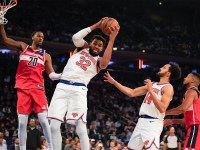 Knicks center Karl-Anthony Towns (32) rebounds