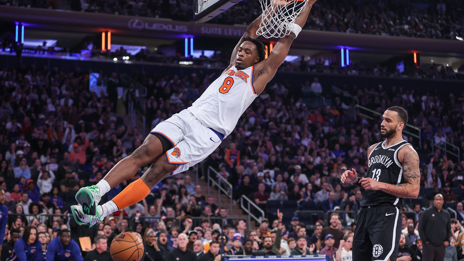 New York Knicks forward OG Anunoby (8) dunks past Brooklyn Nets guard Tyrese Martin (13) in the first quarter at Madison Square Garden.