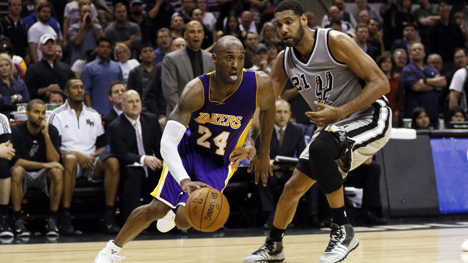 Los Angeles Lakers shooting guard Kobe Bryant (24) drives to the basket past San Antonio Spurs power forward Tim Duncan (21) during the second half at AT&T Center. The Lakers won 112-110 in overtime.