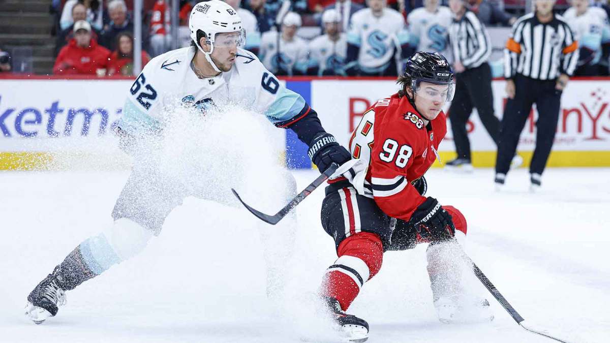 Seattle Kraken defenseman Brandon Montour (62) defends against Chicago Blackhawks center Connor Bedard (98) during the first period at United Center.