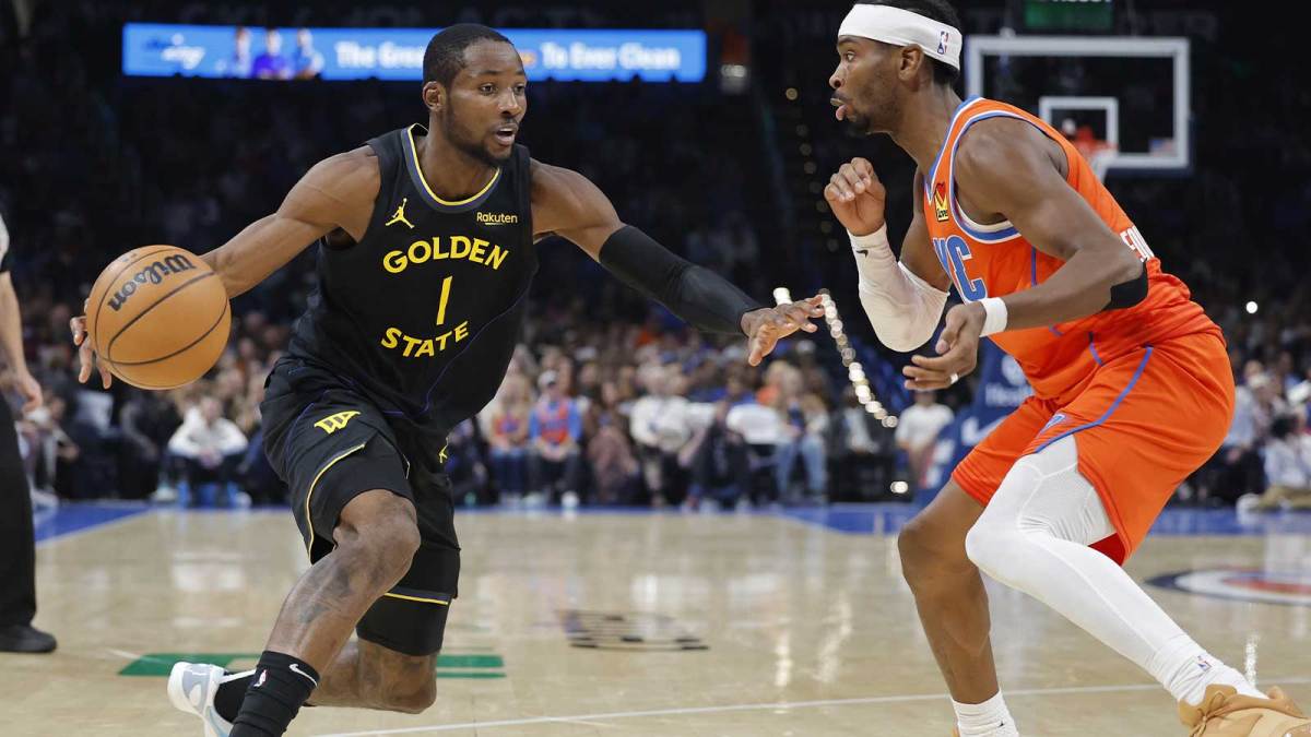 Golden State Warriors forward Jonathan Kuminga (1) moves the ball down the court beside Oklahoma City Thunder guard Shai Gilgeous-Alexander (2) during the second half at Paycom Center.
