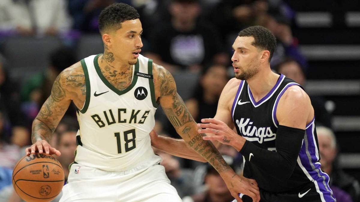 Milwaukee Bucks forward Kyle Kuzma (18) dribbles against Sacramento Kings guard Zach LaVine (right) during the third quarter at Golden 1 Center.