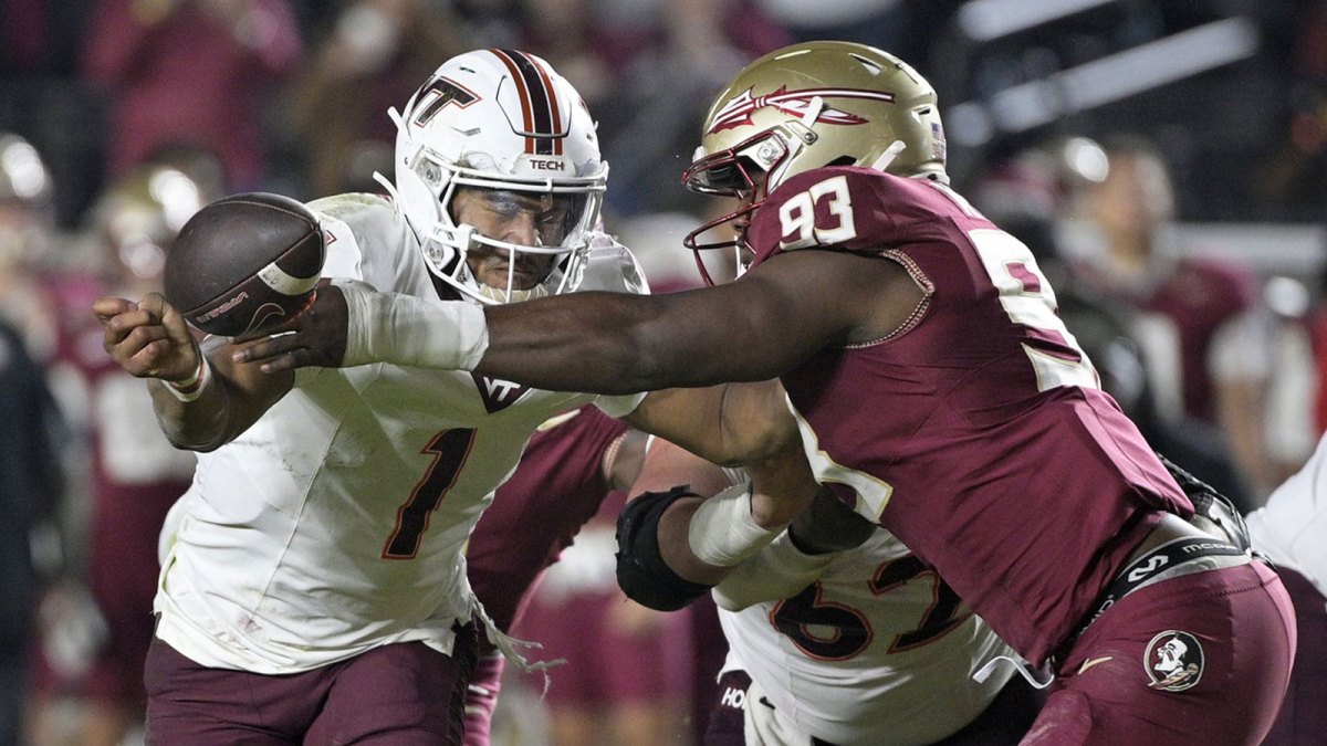 Virginia Tech Hokies quarterback Kyron Drones (1) has the ball knocked away by Florida State Seminoles defensive lineman Mandrell Desir (93) during the second half at Doak S. Campbell Stadium. Mandatory Credit: Melina Myers-Imagn Images