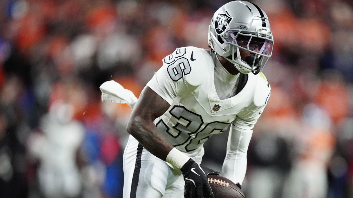Las Vegas Raiders cornerback Kyu Blu Kelly (36) intercepts a pass against the Denver Broncos during the first half at Empower Field at Mile High.
