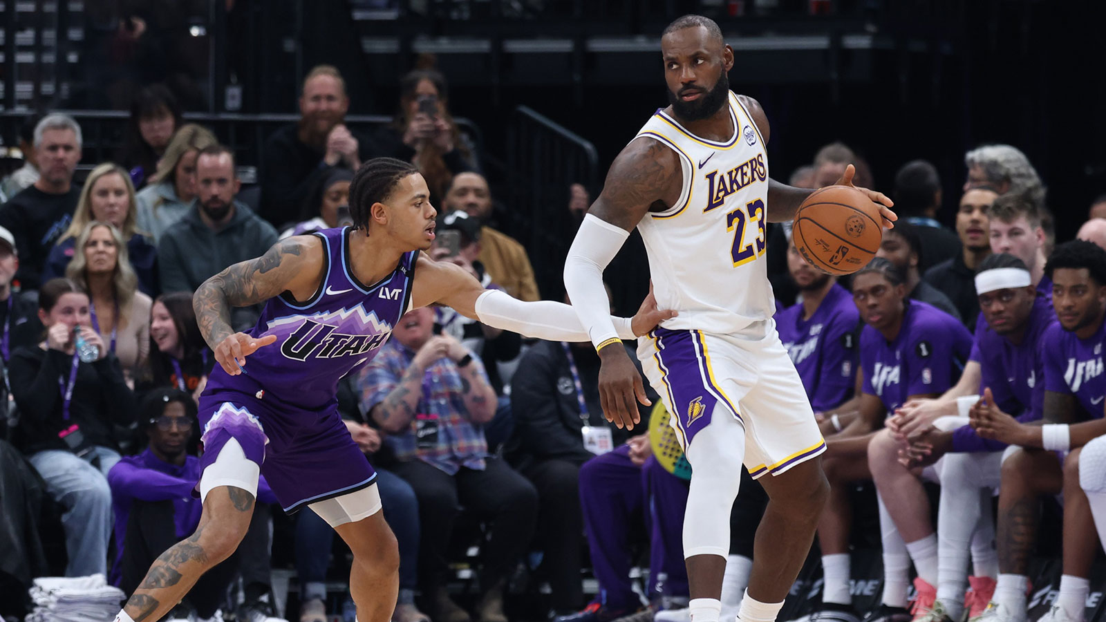 Los Angeles Lakers forward LeBron James (23) dribbles as Utah Jazz guard Keyonte George (3) defends during the second half at Delta Center.