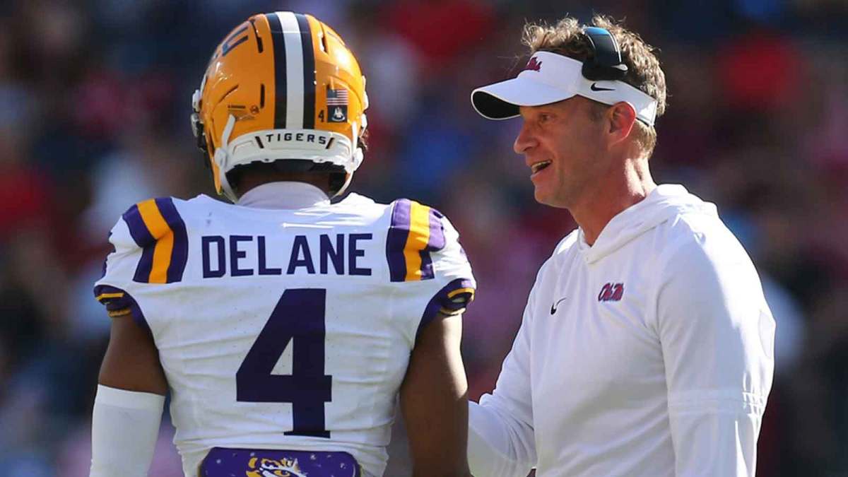 Mississippi Rebels head coach Lane Kiffin talks with LSU Tigers cornerback Mansoor Delane (4) during the second quarter at Vaught-Hemingway Stadium.