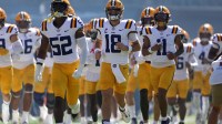 LSU Tigers quarterback Garrett Nussmeier (18) leads his team onto the field prior to the game against the Mississippi Rebels at Vaught-Hemingway Stadium.