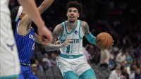 Charlotte Hornets guard LaMelo Ball (1) drives to the basket against Orlando Magic guard Anthony Black during the second half at Spectrum Center.