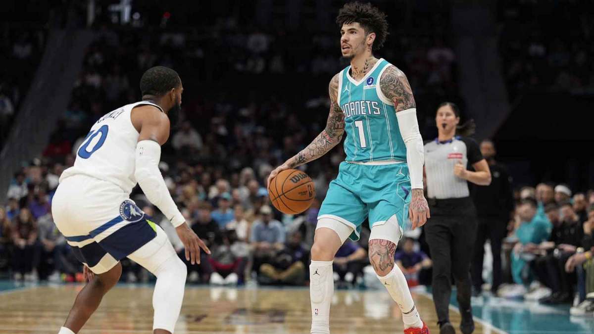 Charlotte Hornets guard LaMelo Ball (1) sets the play defended by Minnesota Timberwolves guard Mike Conley (10) during the first quarter at Spectrum Center.