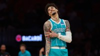 Charlotte Hornets guard LaMelo Ball (1) celebrates after scoring against the Miami Heat during the first quarter at Kaseya Center.