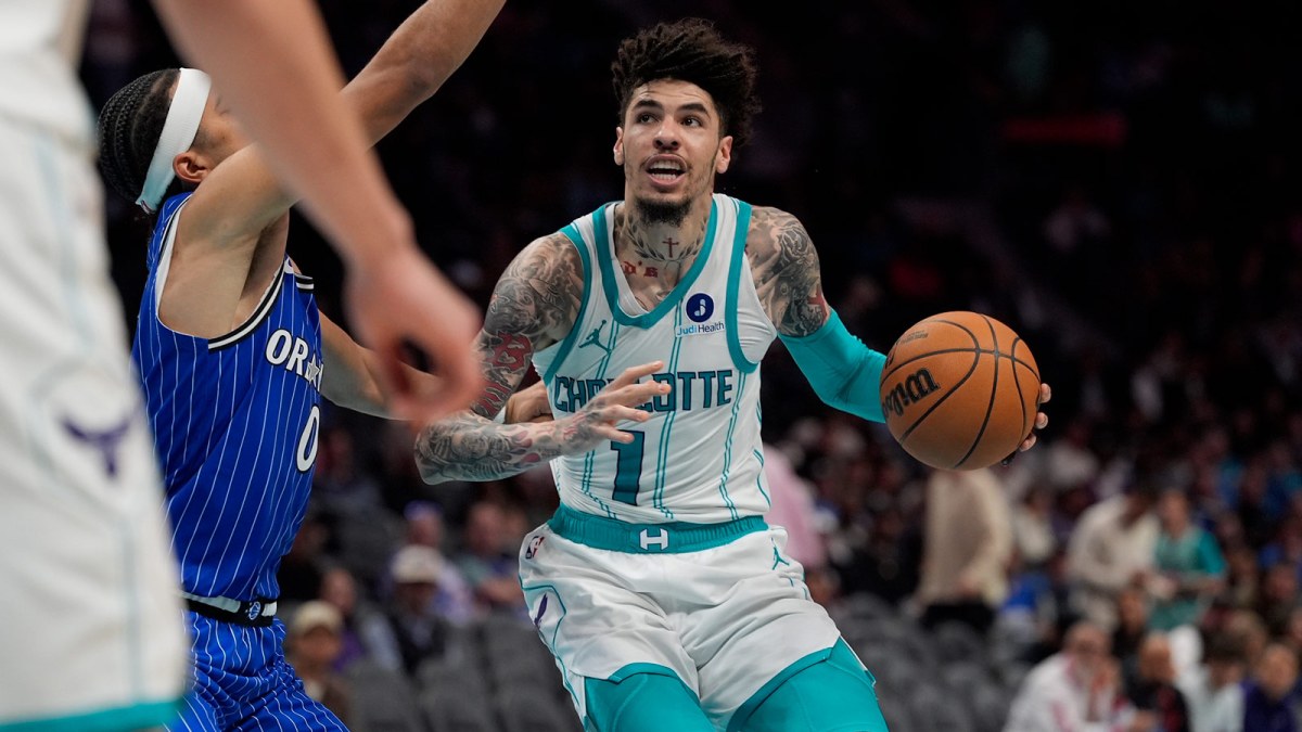 Charlotte Hornets guard LaMelo Ball (1) drives to the basket against Orlando Magic guard Anthony Black during the second half at Spectrum Center.