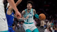Charlotte Hornets guard LaMelo Ball (1) drives to the basket against Orlando Magic guard Anthony Black during the second half at Spectrum Center.