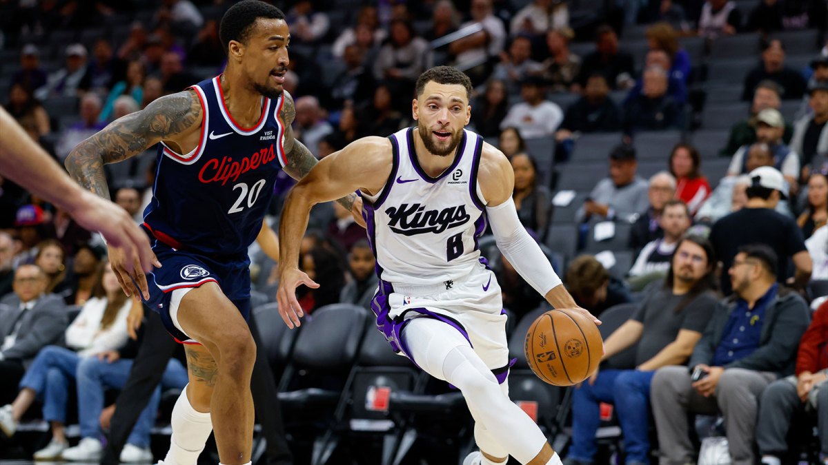 Sacramento Kings guard Zach Lavine (8) dribbles the ball past Los Angeles Clippers forward John Collins (20) during the second quarter at Golden 1 Center
