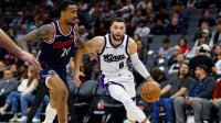 Sacramento Kings guard Zach Lavine (8) dribbles the ball past Los Angeles Clippers forward John Collins (20) during the second quarter at Golden 1 Center