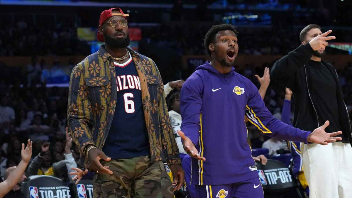Los Angeles Lakers forward LeBron James (left) and son Bronny James (9) react in the second half against the Minnesota Timberwolves at Crypto.com Arena.