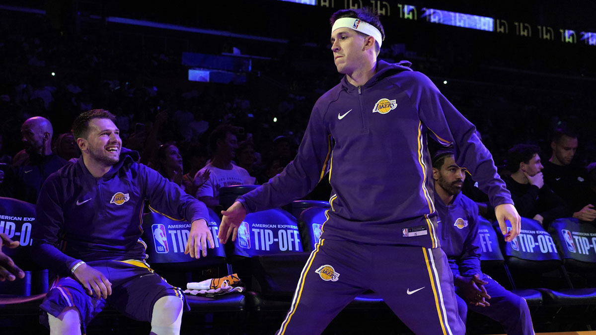 Lakers guard Luka Doncic (left) and guard Austin Reaves (15) interact before the game against the Minnesota Timberwolves at Crypto.com Arena