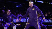 Lakers guard Luka Doncic (left) and guard Austin Reaves (15) interact before the game against the Minnesota Timberwolves at Crypto.com Arena