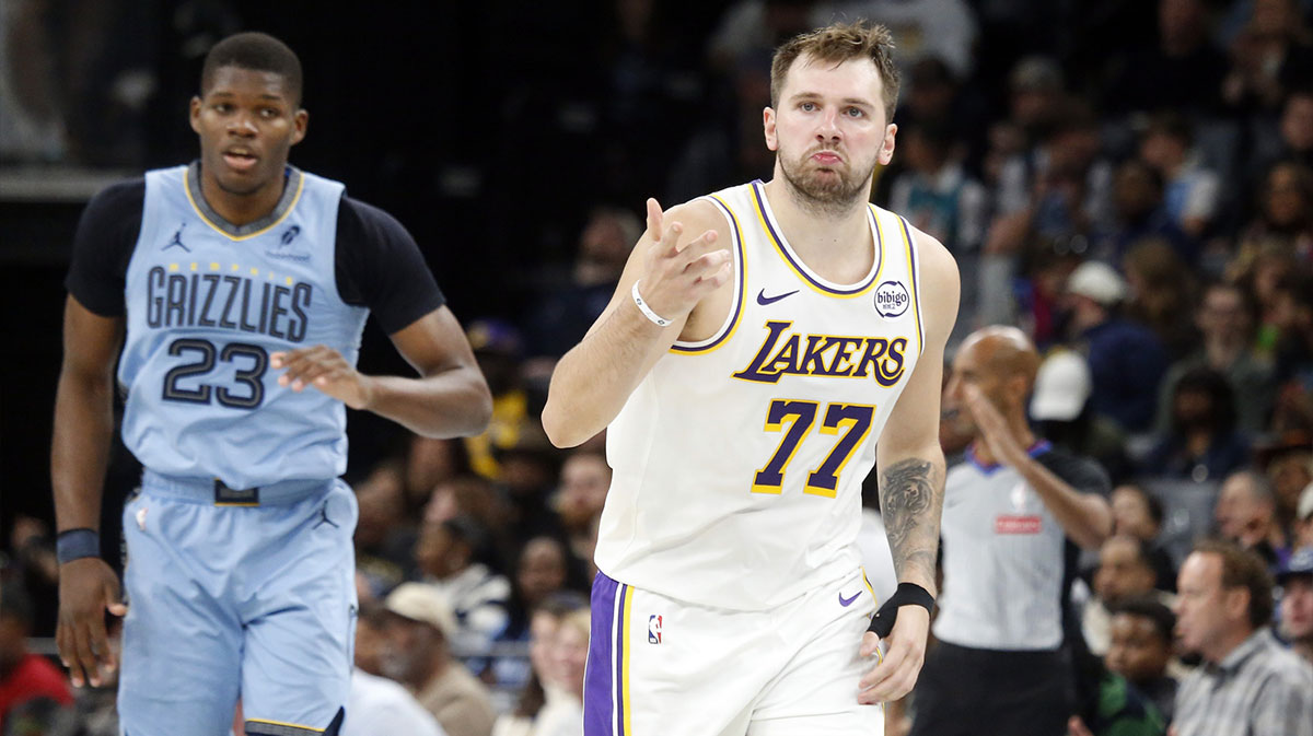 Lakers guard Luka Doncic (77) reacts during the fourth quarter against the Memphis Grizzlies at FedExForum