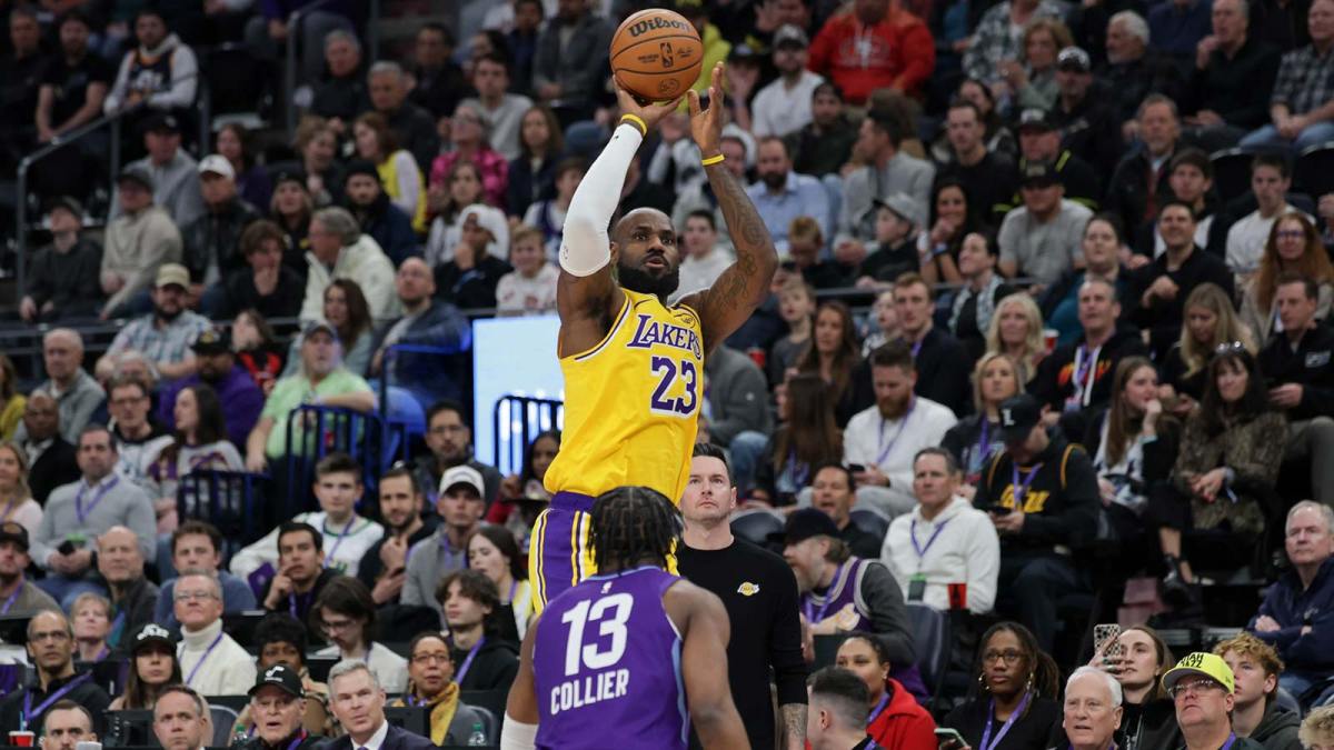 ; Los Angeles Lakers forward LeBron James (23) shoots over Utah Jazz guard Isaiah Collier (13) during the first quarter at Delta Center.