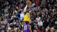 ; Los Angeles Lakers forward LeBron James (23) shoots over Utah Jazz guard Isaiah Collier (13) during the first quarter at Delta Center.