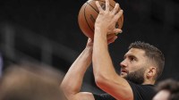 Lakers forward Maxi Kleber (14) warms up on the court prior to the game against the Atlanta Hawks at State Farm Arena with Mavericks GM Nico Harrison in the background