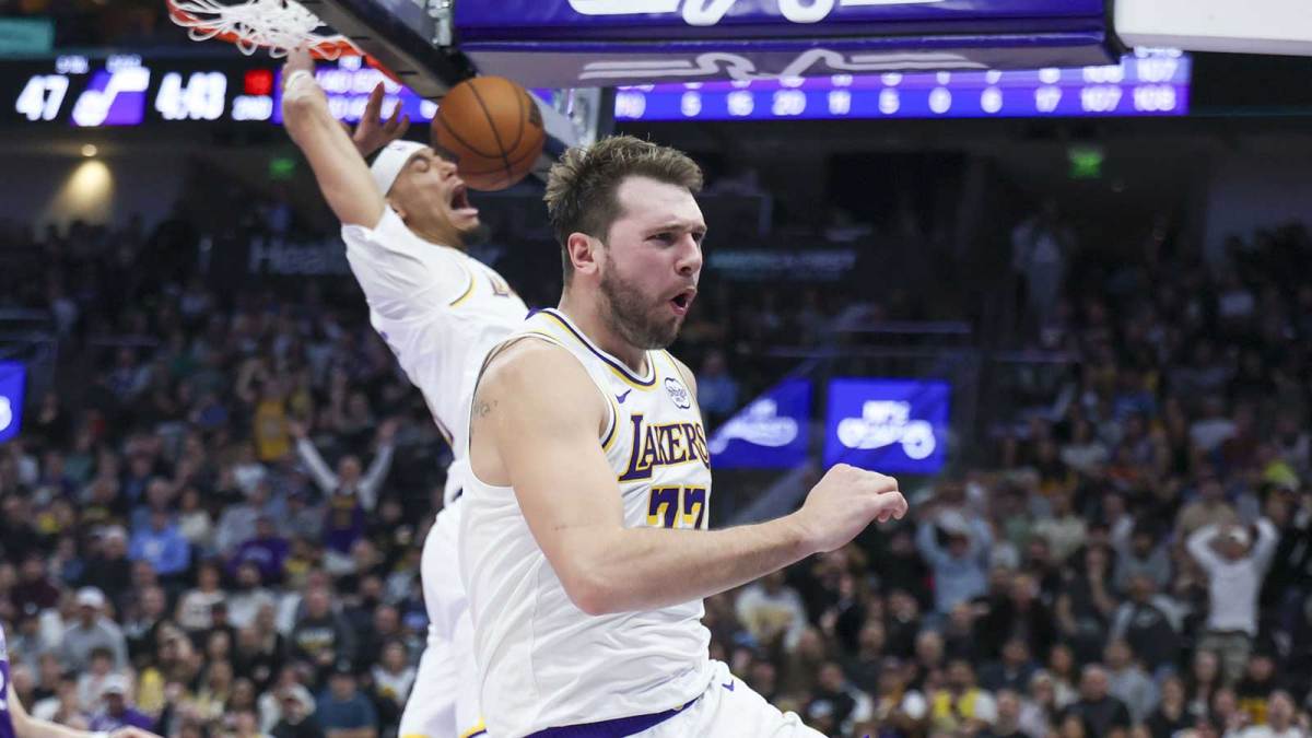 Lakers guard Luka Doncic (77) reacts to a dunk