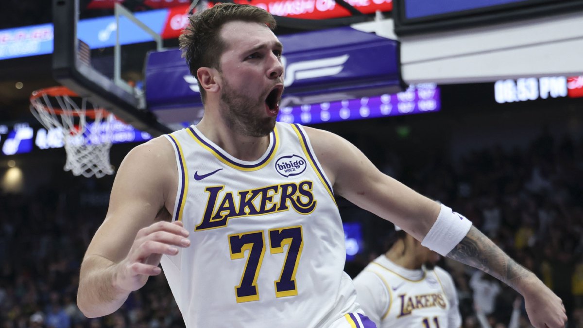 Lakers guard Luka Doncic (77) reacts to a play