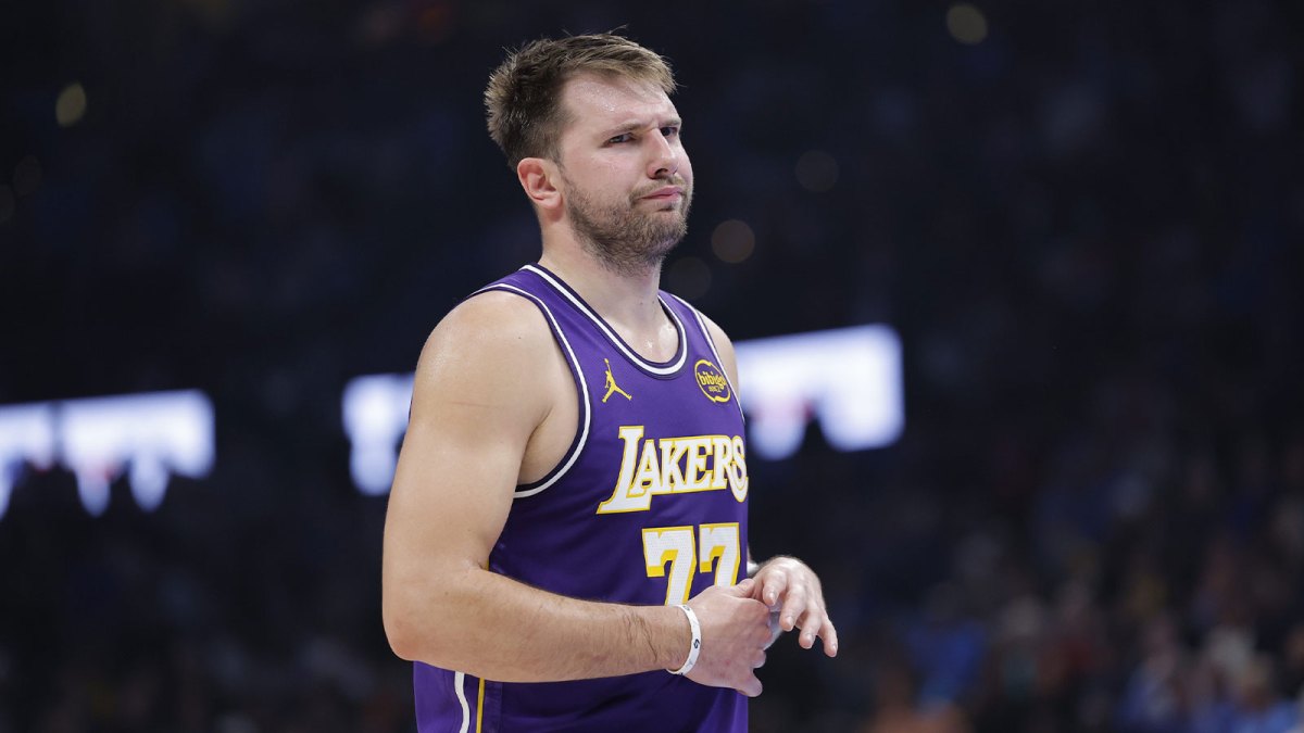 Lakers guard Luka Doncic reacts to a fan