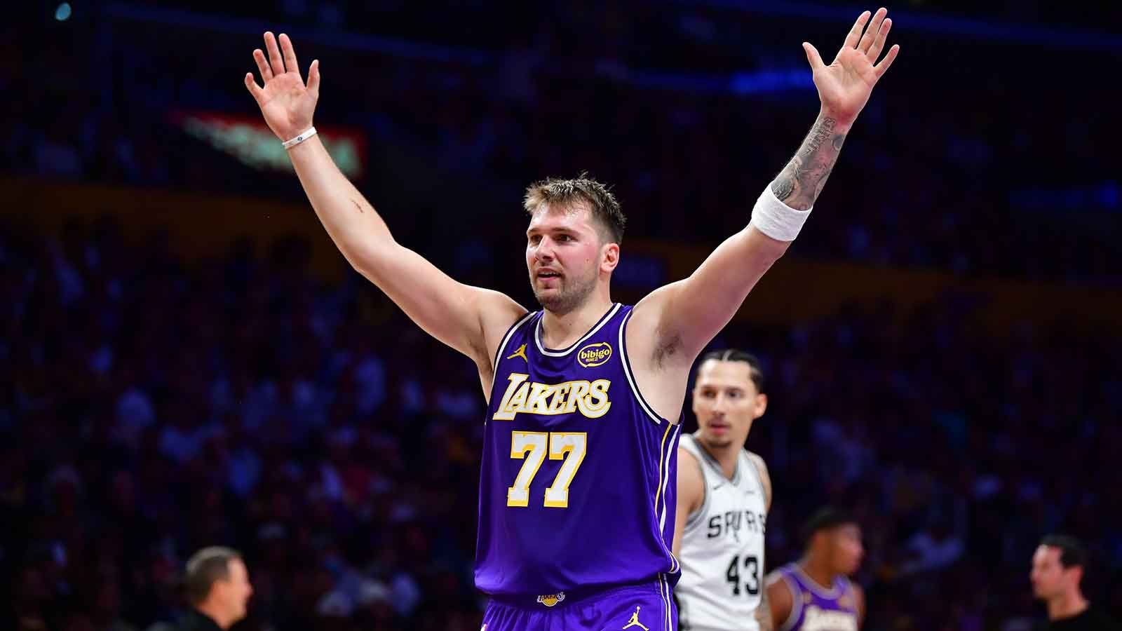 Lakers guard Luka Doncic (77) reacts after scoring a basket against the San Antonio Spurs during the first half at Crypto.com Arena