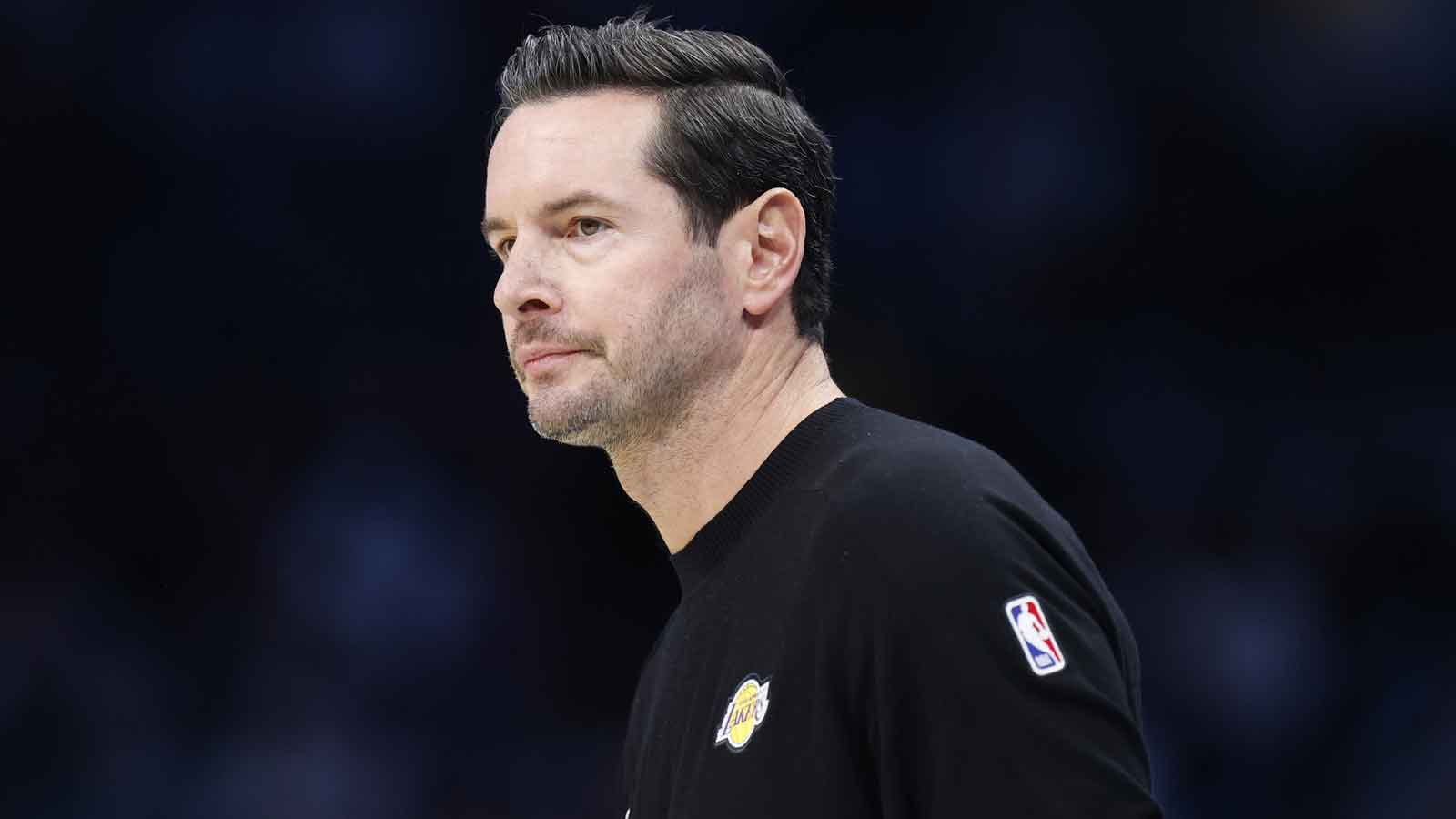 Lakers Head Coach JJ Redick watches from the sideline during the first quarter against the Charlotte Hornets at Spectrum Center
