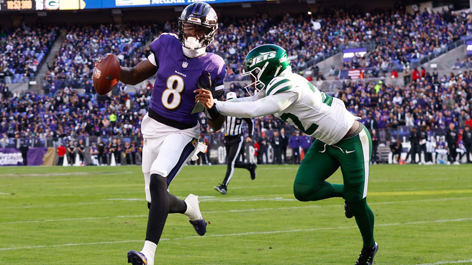Baltimore Ravens quarterback Lamar Jackson (8) rushes as New York Jets safety Tony Adams (22) defends during the third quarter at M&T Bank Stadium. Mandatory Credit: Peter 